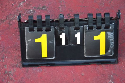 volleyball scoreboard on the cement floor