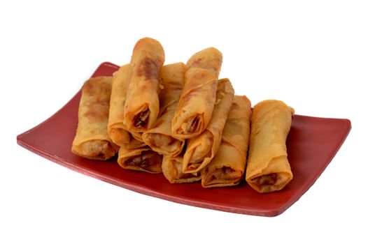 lumpia Semarang or Spring Rolls containing bamboo shoots and chicken on red plate at white background 