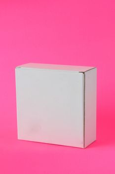 white carton on pink background