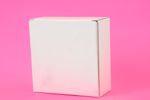 white carton on pink background