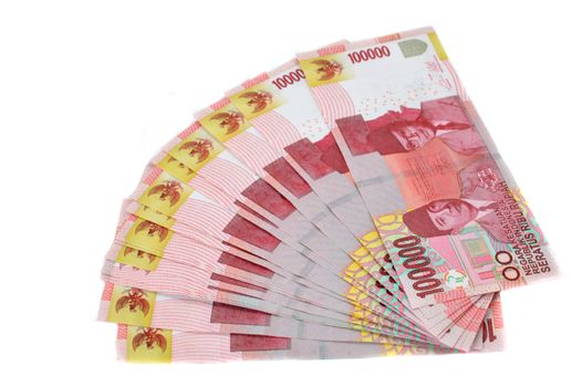 One hundred thousand rupiah Indonesian paper money on white background