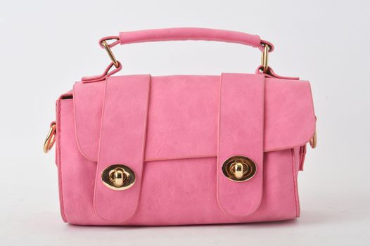 pink leather bag on white background