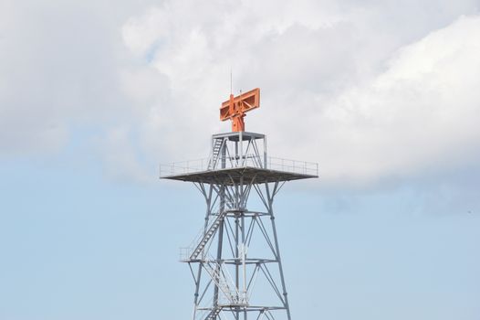 red radar against blue sky