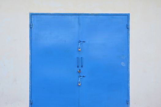 blue iron door on the warehouse