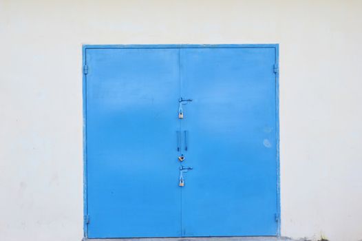 blue iron door on the warehouse