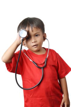 asian little boy dressed in red shirts holding a stethoscope with white background