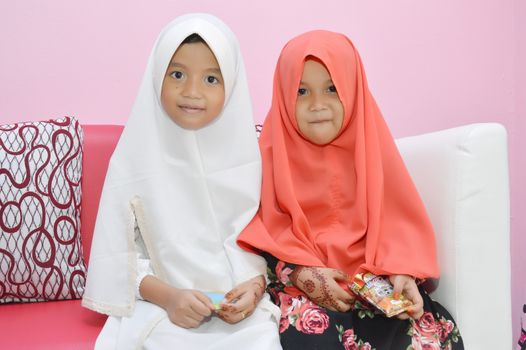 two Asian little girl Muslim