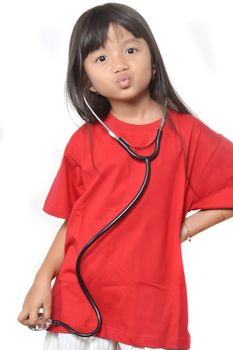 asian little girl dressed in red with a stethoscope