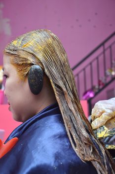 Coloring hair in beauty salon