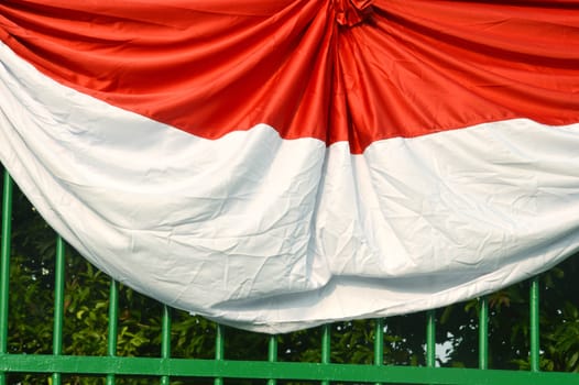 Indonesia's flag as decoration on iron fence