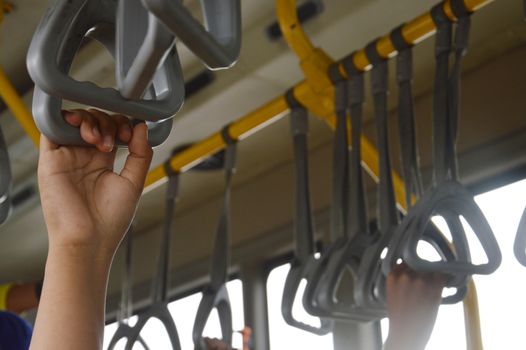 strap hangers on the bus