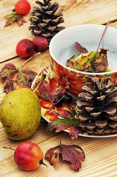 Symbols of autumn, fallen leaves, November, tea