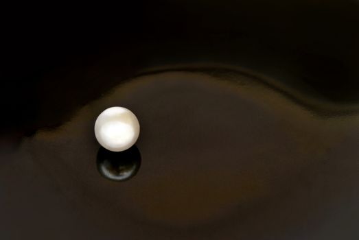 Fake pearls on a black background.