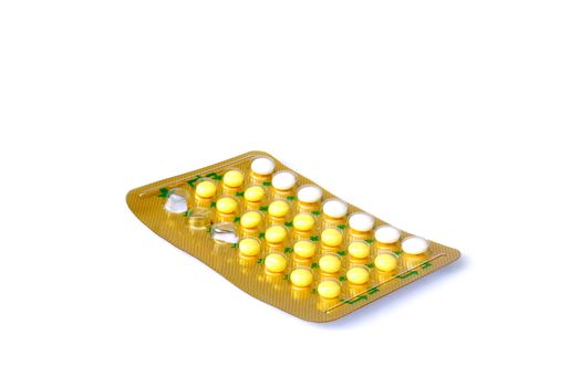 28 pill contraceptives on white background.