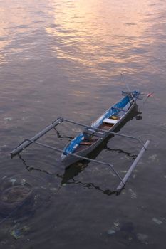 small wooden fisherman boat at the sea