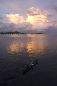 small wooden fisherman boat at the sea