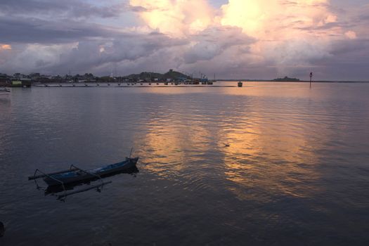 small wooden fisherman boat at the sea