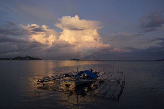 small wooden fisherman boat at the sea