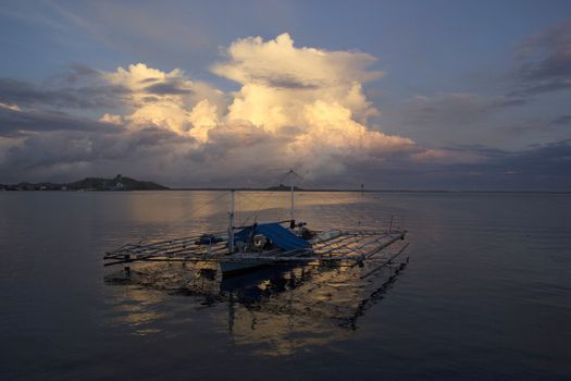 small wooden fisherman boat at the sea