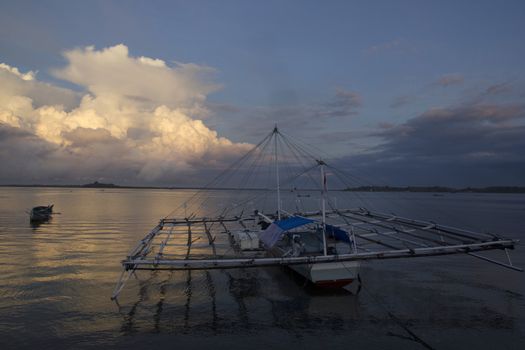 small wooden fisherman boat at the sea