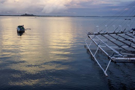 small wooden fisherman boat at the sea