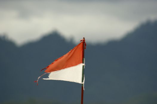 Indonesia's flag against blue sky