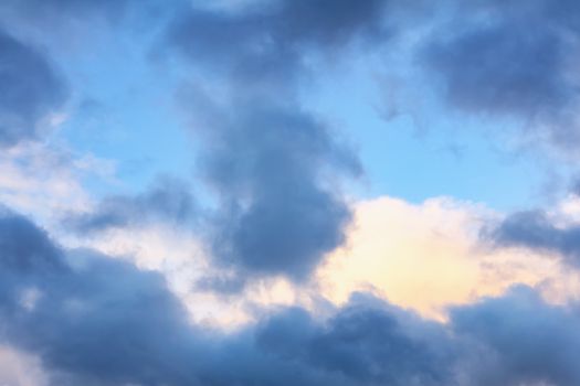 Beautiful cumulus clouds in the blue sky on a summer day.