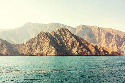 Sea and rocky shores in the fjords of the Gulf of Oman.