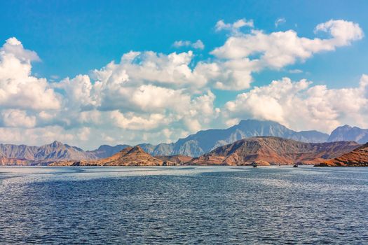 Sea and rocky shores in the fjords of the Gulf of Oman, panoramic view.