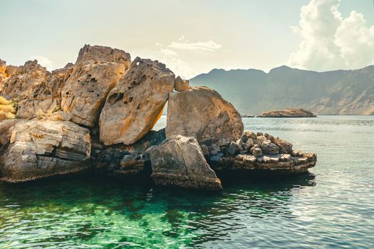 Sea and rocky shores in the fjords of the Gulf of Oman.