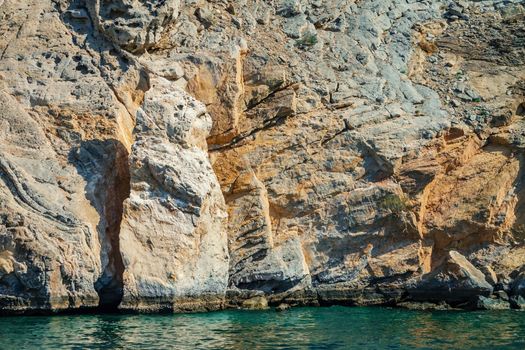 Sea and rocky shores in the fjords of the Gulf of Oman.