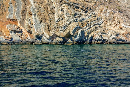 Sea and rocky shores in the fjords of the Gulf of Oman.