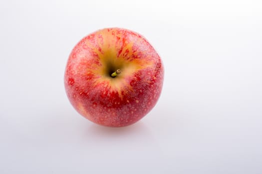 Fresh red apple on a white background