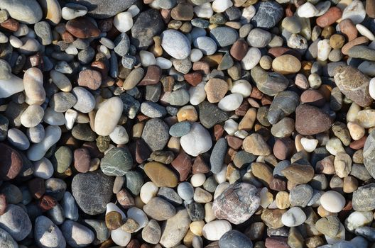 background made of a closeup of a pile of pebbles gravel stone