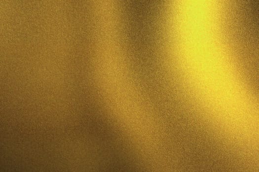 Light shining on golden metallic wall in dark room, abstract texture background