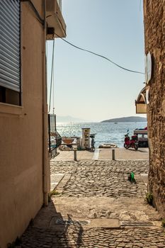 a narrow view of sea between old buildings. photo has taken at izmir/turkey.