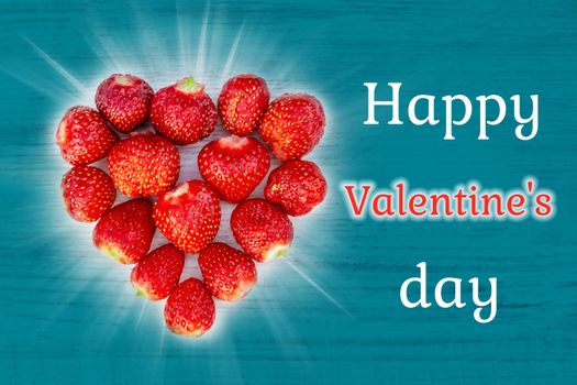 Beautiful card with a greeting on Valentine's Day - heart strawberries on turquoise background textures and the words Happy Valentine's Day.