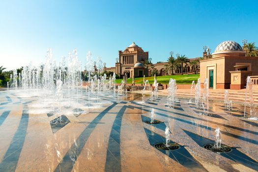 Garden and fountains outdoors of Emirates Palace a luxurious 7 star hotel in Abu Dhabi.