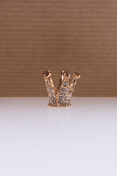 Crown with a notebook on a white background