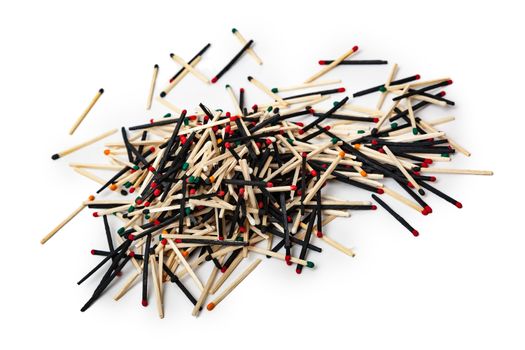 A lot of matches are mixed, of different color, isolated on white background