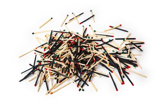 A lot of matches are mixed, of different color, isolated on white background