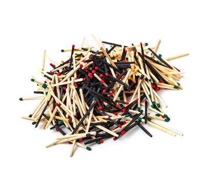 A lot of matches are mixed, of different color, isolated on white background