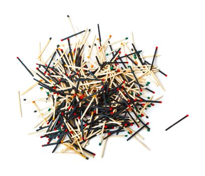 A lot of matches are mixed, of different color, isolated on white background