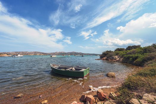 fishing boat on a wild beach in Sardinia, Italy