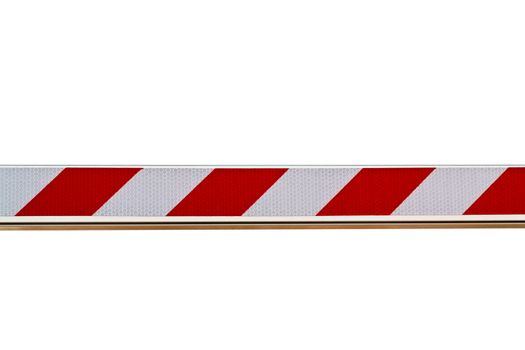 Red and white striped barrier isolated on white background.