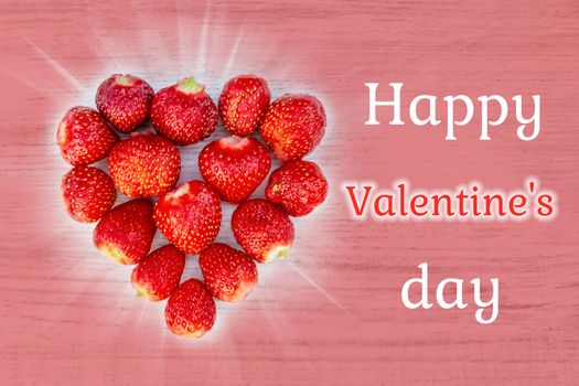 Beautiful card with a greeting on Valentine's Day - heart strawberries on a pink background textures and the words Happy Valentine's Day.