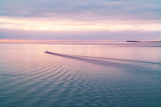 Patrol boat in the Finnish Gulf at sunset.