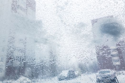 Windshield from inside the car during heavy snowfall.