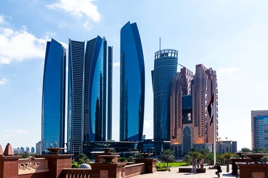 Skyscrapers and landscaping elements in the center of Abu Dhabi near the Emirates Palace.