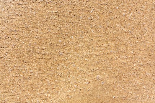 large Golden sand of the sea, the surface of the sea coast, texture, background.